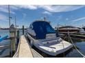 Clean boat docked with cover titled 