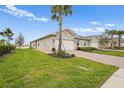 Well-maintained home with lush green lawn and inviting landscaping at 1524 Remington Trace Dr, Port Charlotte, FL 33953
