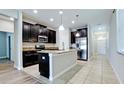Modern kitchen with stainless steel appliances and a center island at 1819 Redmond Brook Ln, Ruskin, FL 33570
