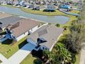 Charming single-Gathering home with lush landscaping and a serene water view at 3708 Wayfarer Way, Palmetto, FL 34221