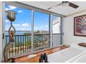 Bright living room with stunning waterfront views, floor-to-ceiling windows, and modern decor at 435 S Gulfstream Ave # 1103, Sarasota, FL 34236