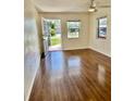 Bright living room with wood floors, natural light, and an open entryway at 4511 Ardale St, Sarasota, FL 34232