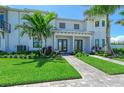 Charming townhome with well-manicured lawn, professional landscaping and a beautiful stone walkway at 6013 White Mangrove Ln, Bradenton, FL 34210