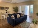 Inviting living room features hardwood floors and comfortable furnishings at 6032 Arlene Way, Bradenton, FL 34207