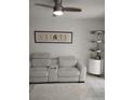 Cozy living room with a plush couch and decorative accents at 6924 Stones Throw N Cir # 8105, St Petersburg, FL 33710