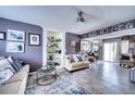 Inviting living room with a built-in display case and lots of natural light at 7067 Jarvis Rd, Sarasota, FL 34241