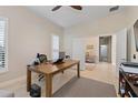 Bright office space with neutral walls, tile flooring and an ensuite bathroom at 11981 Hunters Creek Rd, Venice, FL 34293