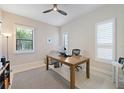 Bright office space with natural light, a ceiling fan, neutral walls, and tile flooring at 11981 Hunters Creek Rd, Venice, FL 34293