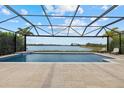 Screened-in pool with great views and a beautiful pool deck, perfect for outdoor entertaining and relaxation at 17610 Polo Trl, Bradenton, FL 34211