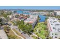 Expansive aerial view of the property and surrounding marina showcasing waterfront community and manicured landscaping at 250 Santa Maria St # 215, Venice, FL 34285