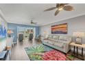 Cozy living room featuring stylish decor, comfortable seating, and lovely marina view at 250 Santa Maria St # 215, Venice, FL 34285