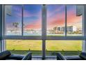 Breathtaking marina view through the large glass window, providing a serene and picturesque backdrop at 250 Santa Maria St # 215, Venice, FL 34285