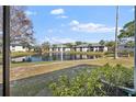 Charming pond view featuring tranquil waters with a fountain, surrounded by well-manicured lawns and condo buildings at 4330 47Th W Ave # 104, Bradenton, FL 34210