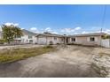 Exterior view of the home with an attached garage and a concrete driveway at 507 59Th St, Holmes Beach, FL 34217