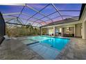 Resort-style covered pool and spa area features an outdoor kitchen and a spacious patio at 8455 Lindrick Ln, Bradenton, FL 34202