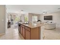 Spacious kitchen island opens to dining and living areas at 8928 Excelsior Loop, Venice, FL 34293