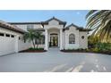 Beautiful exterior showcasing meticulous landscaping, manicured lawn and a well-maintained home at 9818 Old Hyde Park Pl, Bradenton, FL 34202