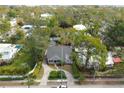 Birds-eye-view of home and neighborhood with mature landscaping and tree coverage at 1231 S Orange Ave, Sarasota, FL 34239