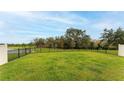 Spacious, well-maintained backyard with a fence, perfect for outdoor activities and privacy at 12534 Nantahala Run Run, Parrish, FL 34219