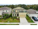 Charming two-story home with a manicured lawn and a paved driveway, offering inviting curb appeal at 12534 Nantahala Run Run, Parrish, FL 34219