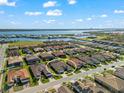 An aerial view of a waterfront community featuring beautiful homes and canal access, encircled in white at 1805 7Th St E, Palmetto, FL 34221