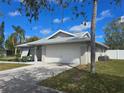 Well-maintained single-story home with a spacious two-car garage and nice landscaping at 3507 65Th Avenue E Cir, Sarasota, FL 34243