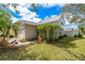 Charming two-story home featuring a manicured lawn and lush landscaping at 3831 Day Bridge Pl, Ellenton, FL 34222