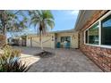 This beautiful home has a brick and siding exterior, paved driveway, and well-maintained landscaping at 5525 Shadow Lawn Dr, Sarasota, FL 34242