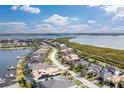 Wide aerial shot showcasing a residential area with waterfront views and well-maintained homes at 5608 Tidewater Preserve Blvd, Bradenton, FL 34208