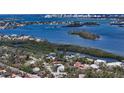 Aerial view of a waterfront community showing the home's location near the water and downtown at 614 Tropical Cir, Sarasota, FL 34242