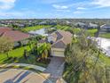 Overhead view of a beautiful home and the surrounding community, highlighting the property's layout and landscaping at 7108 Callander Cv, Lakewood Ranch, FL 34202