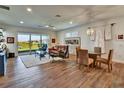 Inviting living room with a large sliding door to the patio, elegant furnishings, and wood-look flooring, perfect for relaxation at 8192 Sternway Rd, Sarasota, FL 34240