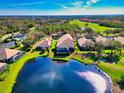 Wonderful aerial view of the property backing onto a beautiful lake and golf course at 8310 Tartan Fields Cir, Lakewood Ranch, FL 34202