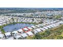Aerial view of the community showcasing the home's location near the lake and other residences at 970 Jolanda Cir, Venice, FL 34285