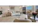Cozy living room featuring tile floors, comfortable seating, and a lovely ocean view at 101 Benjamin Franklin Dr # 71, Sarasota, FL 34236