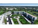 Aerial view of the condo community and golf course, showcasing the lush landscaping and building exteriors at 3860 Ironwood Ln # 503G, Bradenton, FL 34209