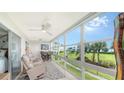 Relaxing sunroom with large windows offering scenic outdoor views and comfortable seating at 4600 Gulf Of Mexico Dr # 202, Longboat Key, FL 34228