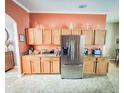 Bright kitchen featuring stainless steel appliances, generous counter space, and plenty of cabinet storage at 4839 Turtle Bay Ter, Bradenton, FL 34203