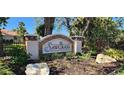 Attractive Sawgrass community sign surrounded by lush landscaping, plants and decorative rocks at 629 Sawgrass Bridge Rd, Venice, FL 34292