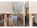 Interior view of a house ready for renovation, showing exposed framing and open spaces at 713 Saint Judes S Dr # 1, Longboat Key, FL 34228