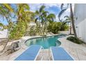 Beautiful backyard pool and patio area perfect for relaxation and entertaining at 9 Palm Harbor Dr, Holmes Beach, FL 34217