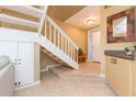 Inviting foyer with staircase, tiled floors, and a charming decor, perfect for a warm welcome at 903 Pinellas Bayway S # 102, St Petersburg, FL 33715