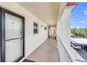 Exterior hallway showcasing unit entry with secure access and covered parking at 915 Beach Rd # 318, Sarasota, FL 34242