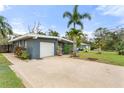 Well maintained exterior with a single car garage and spacious driveway at 1604 Edna Ave, Largo, FL 33770