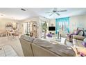 Bright living room with sliding glass doors and neutral decor with comfortable seating at 2832 74Th W St # 2180, Bradenton, FL 34209