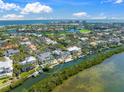 Breathtaking aerial view of the home's location on a canal with bay access and resort-style community at 3421 Bayou Sound, Longboat Key, FL 34228