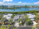 Beautiful aerial view of a home with mature landscaping in a waterfront community near the bay at 3421 Bayou Sound, Longboat Key, FL 34228