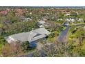 Aerial view of a residential neighborhood showcasing mature trees and well-maintained homes at 3825 Wilshire Cir # 1, Sarasota, FL 34238