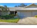 Charming single-story home boasts a well-manicured lawn and attached two car garage at 3825 Wilshire Cir # 1, Sarasota, FL 34238