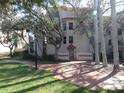 Beautiful condominium exterior with a tile roof and an inviting entrance walkway at 4555 Bay Club Dr # 22, Bradenton, FL 34210